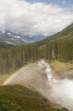 Krimml Waterfalls with rainbow. They have a total height of 380 metres (1, 247 feet) and are the
