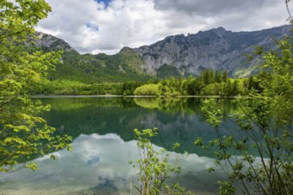 Landscape of Lake Offensee after rain when the sun comes through the clouds in spring,
