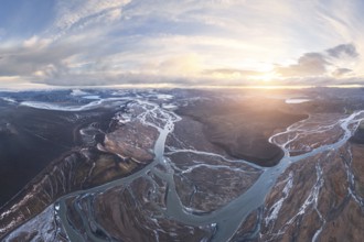 Aerial view of Iceland's highlands, showcasing intricate river networks weaving through rugged