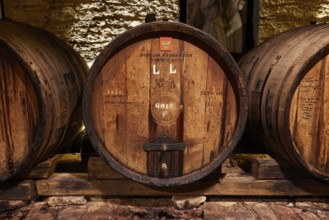 Vladimir Putin wine barrel, detailed view of a wooden barrel in a historic wine cellar, Achaia