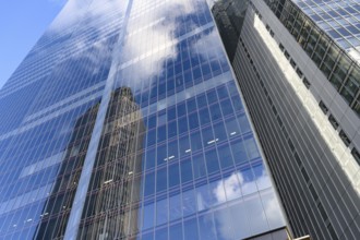 Modern abstract reflections in glass fronted commercial office buildings in the financial district