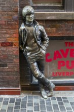 Statue sculpture of John Lennon of the Beatles, Mathew Street, Liverpool, Merseyside, England, UK