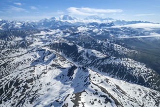 Clouds over high mountains, Mt Foraker and Mt Denali or Mount McKinley, aerial view, Alaska Range,