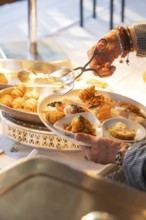 A fine buffet in the restaurant is lovingly presented under a lamp, Europäischer Hof, Königsbach