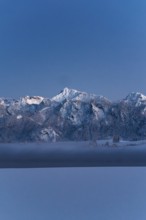 Shortly after sunset, twilight at Lake Hopfensee in the Allgäu in Bavaria in a winter landscape,
