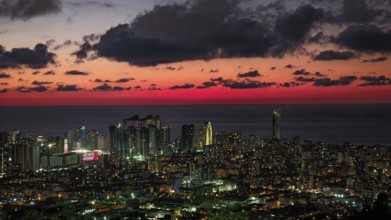 Illuminated skyline at impressive sunset with clouds in the sky, Batumi, Georgia