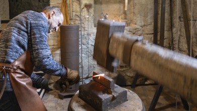 An elderly blacksmith in Austria's Salzburg region passionately upholds the centuries-old
