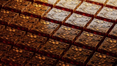 This background showcases a complex arrangement of abstract circuitry, with warm orange hues and