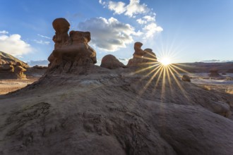 Dramatic sandstone formations in Goblin Valley State Park, Utah, USA, are illuminated by the