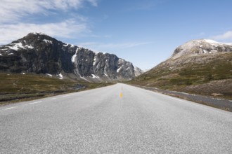 Experience the breathtaking scenery of Norway with a road trip through serene mountains Perfect for
