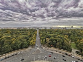 View from Victory Column, A dramatic cloudy sky over Berlin with a long avenue flanked by autumn