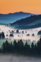 View from the Raten Pass over the fog-covered high moor of Rothenthurm in the canton of Schwyz,