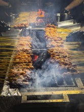 Satay, Asian food, dish which is seasoned, skewered and grilled meat over hot burning charcoal on a