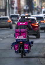 Bicycle courier of the Flink express delivery service, delivers groceries, currently in over 40