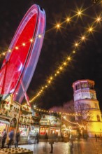Rhine promenade with Castle Tower and illuminated Ferris wheel at dusk, Dusseldorf, North