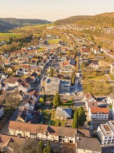 Aerial view of a neighbourhood with houses and streets surrounded by hills, Nagold, Black Forest,