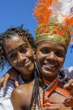 Colourful costumed, pretty, young woman with boyfriend. Carnival. Mindelo. Cabo Verde. Africa