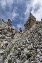 Mountaineer on the steep ascent to Waxenstein, Wetterstein Mountains, Garmisch-Patenkirchen,
