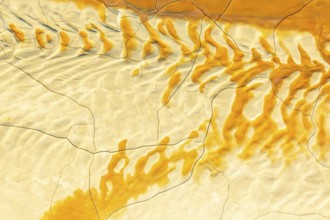 Aerial view of textured golden mud patterns, creating abstract and organic designs across a
