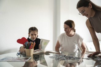 A joyful family moment with a girl with a tracheostomy engaging in art and puzzles, surrounded by