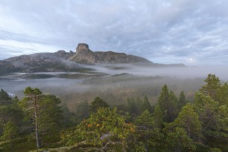 Magical morning fog on Steigtindvatnet in front of the majestic Steigtinden in Norway near Bodø