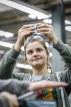 Remscheid, North Rhine-Westphalia, Germany - Trainee woman in metalworking here a materials tester