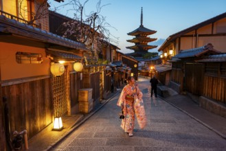 Japanese woman in kimono in an alley, Yasaka dori historic alleyway in the old town with