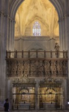 Impressive Gothic church architecture with ornate decorations and light effects, Seville,