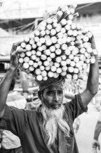 Portrait of a man with wood on his head, monochrome, Dhaka, Bangladesh