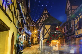 Houses illuminated and decorated for Christmas, Christmas market, blue hour, Eguisheim, Haut-Rhin