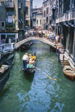 Gondolier gondola boat bridge over the Rio del Palazzo, Venice, Italy 1969