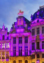 The illuminated golden horseman Charles de Lorraine on the guildhall L'Arbre d'Or, Guild of