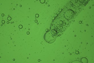 A detailed image showcasing a vibrant aloe vera liquid for a serum cosmetic, creating a mesmerizing