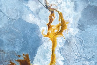 Aerial photo capturing a vibrant, abstract landscape where natural textures and colors mix