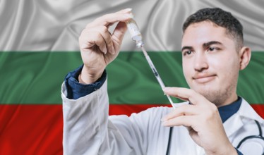 Doctor holding syringe on Bulgaria flag background. Medical professional holding syringe with