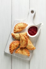 Fried chebureks, close-up, on a light background, no people
