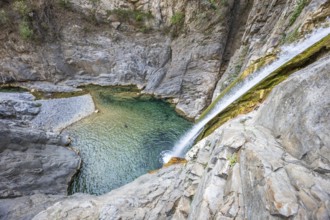 A breathtaking view of a canyon with crystal-clear waters, perfect for adventure seekers enjoying