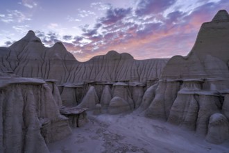 A breathtaking landscape view of the Bisti/De-Na-Zin Wilderness in New Mexico, showcasing striking