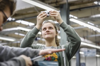 Remscheid, North Rhine-Westphalia, Germany - Trainee woman in metalworking here a materials tester