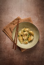 Japanese fried gyoza dumplings, with pork, sesame seeds, green onions