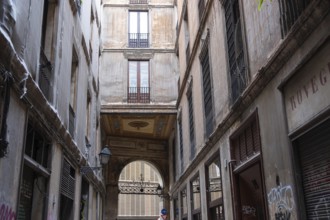 Alley and building bridge in the historic centre of Barcelona, Spain
