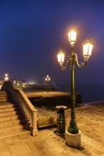 Lanterns at 'Alilaguna' on a evening in the blue hour in Venice in winter, Italy