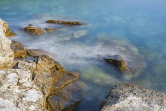 Crystal clear and turquoise water on the beach of Ustrine Bay on a sunny day on the island of Cres,