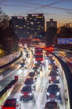 Evening traffic, partly with traffic jams, slow-moving traffic on the A40 motorway, Essen skyline,