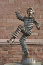 Sculpture of the Mainzer Klepper-Garde, jester with ruff on ball with inscription MKG, carnival