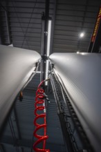 Perspective view of two columns in a workshop with suspension for inner tube, Waldbike Manufaktur,