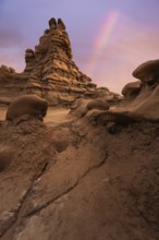 Captivating view of unique sandstone formations under a colorful sky in Goblin Valley State Park,