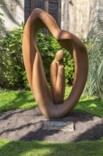 Sculpture by artist Naomi Blake 1980 'Refugee' garden of Bristol cathedral church, Bristol,