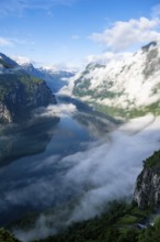 Atmospheric clouds over the fjord in the morning light, view of Geirangerfjord, at Ørnesvingen