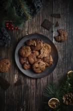 Top view of some tasty chocolate cookies with Christmas decoration